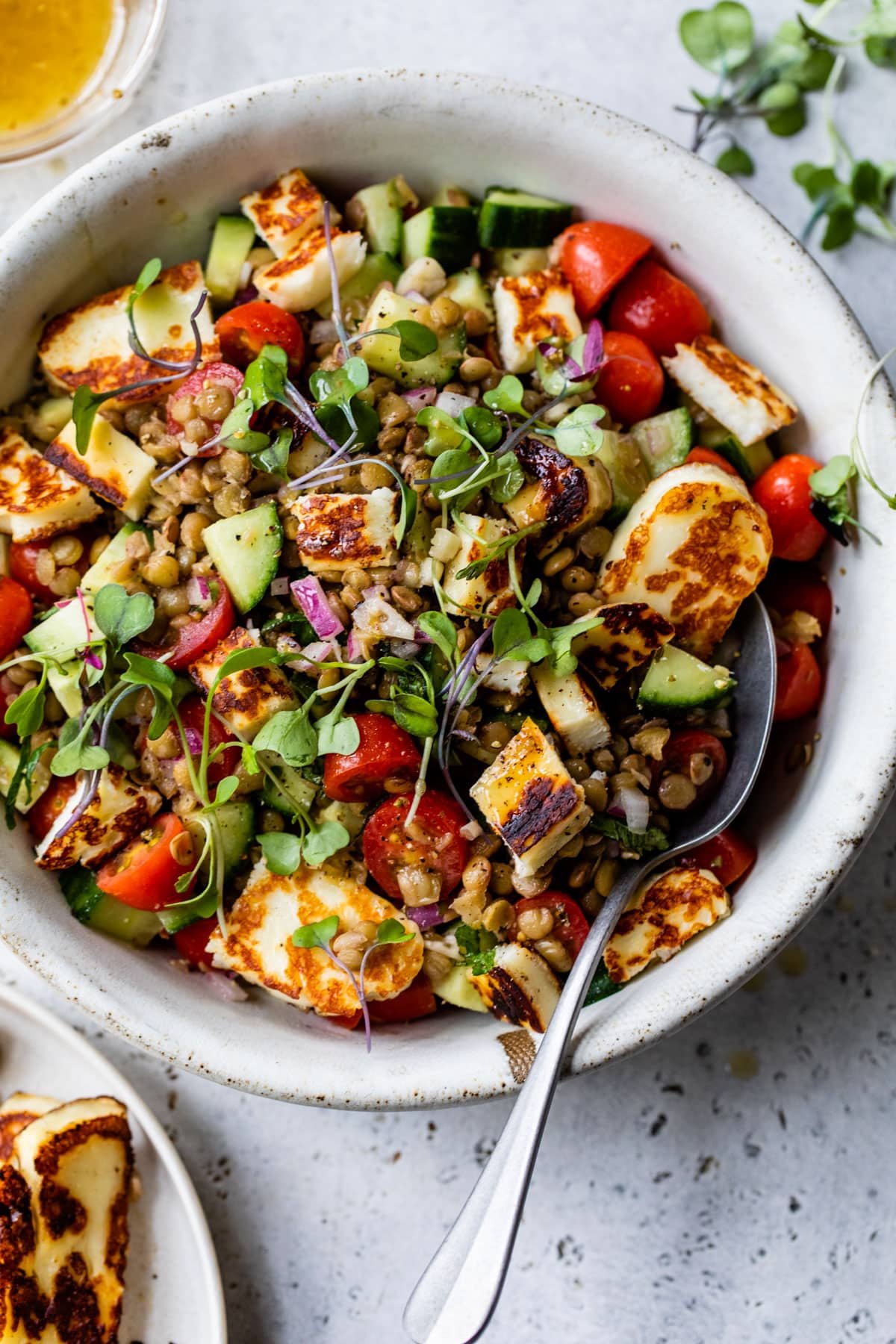 Lentil and chickpea bowl with haloumi